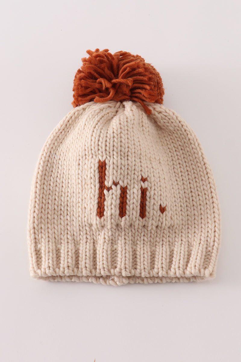 Beige pompom hi cable beanie hat